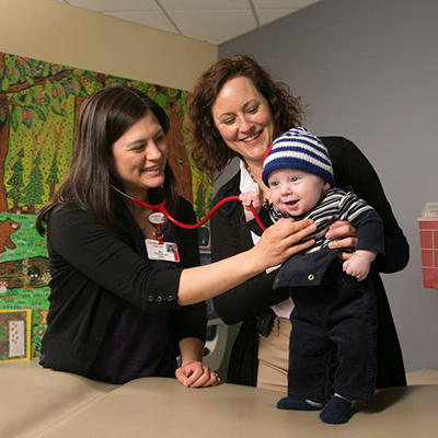 Finn, a 7-month-old boy with complex care needs, has a visit with Mary Ehlenbach, MD, and Kristan Sodergren, NP.