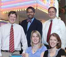 In 2009, four of our physicians-in-training received national recognition for their scholarly work.  Standing, from left: Allergy & Immunology fellow Dan Jackson, MD; resident Dipesh Navsaria, MD, MPH, and Vice Chair for Education John Frohna, MD, MPH.  Seated, from left: Endocrinology & Diabetes fellow Lindsey Nicol, MD, and resident Katherine Baker, MD.